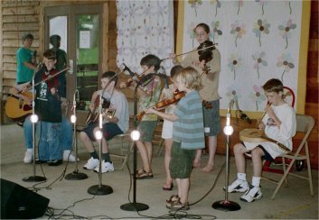 Rachel and students fiddling