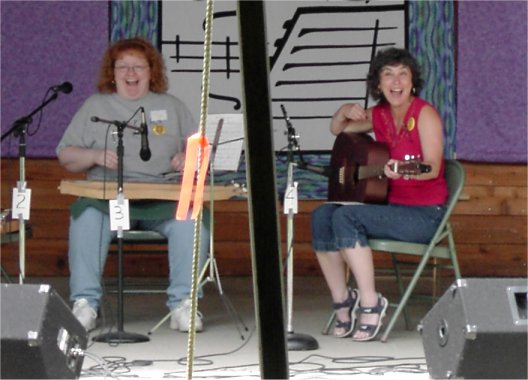 Judy and Judy laughing on stage