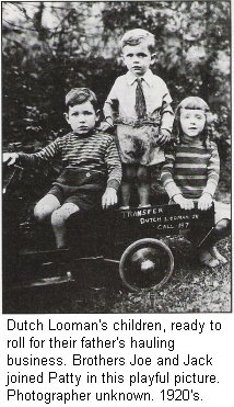 Dutch Looman's children, ready to roll for their father's hauling business. Brothers Joe and Jack joined Patty in this playful picture. Photographer unknown. 1920's.